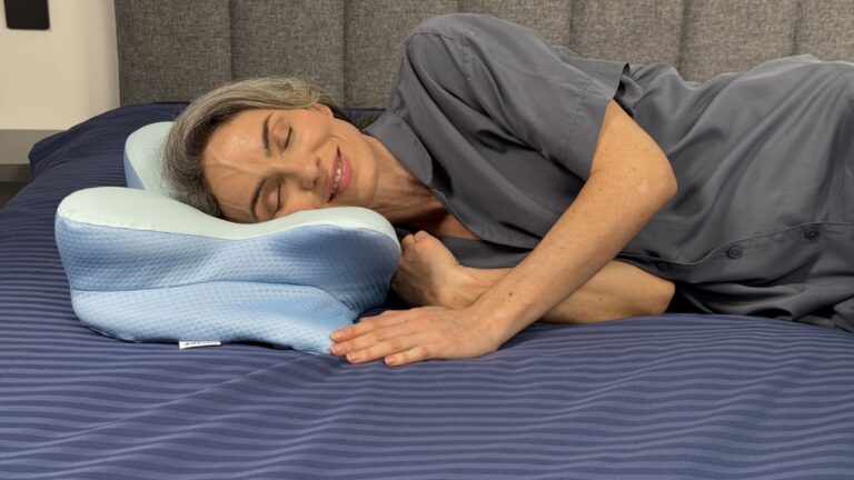 Woman sleeping on Derila Ergo contour memory foam pillow